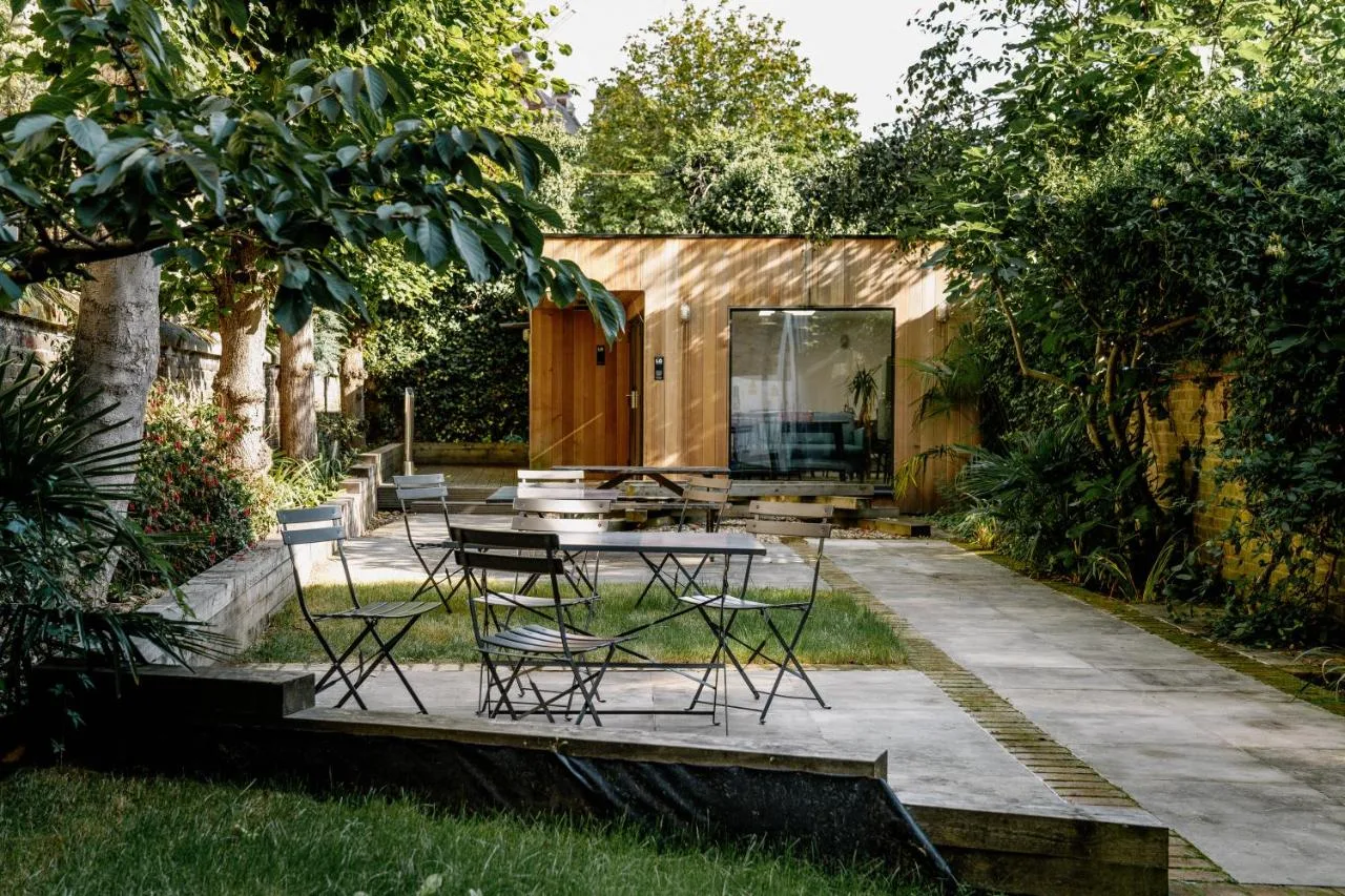 Garden patio with table and chairs at Mason & Fifth, Primrose Hill
