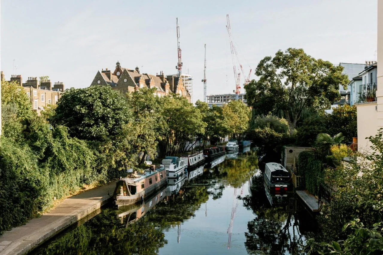 River with boats near buildings and trees close to Mason & Fifth, Primrose Hill